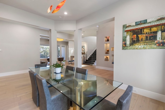 dining space featuring light wood-type flooring