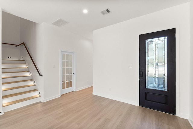 foyer with light hardwood / wood-style floors