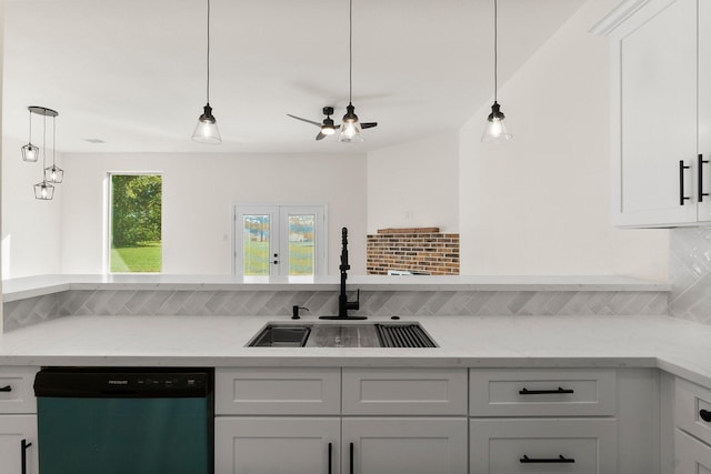 kitchen with dishwasher, backsplash, sink, light stone counters, and white cabinetry