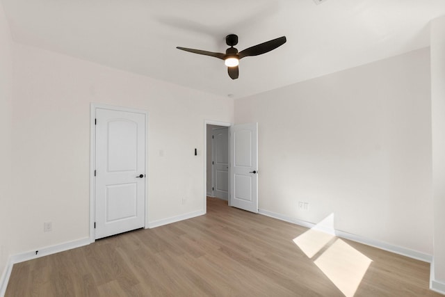 unfurnished bedroom featuring ceiling fan and light hardwood / wood-style flooring