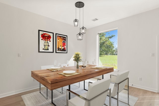 dining room with light hardwood / wood-style flooring