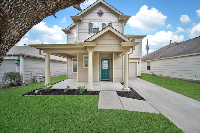 view of front of house featuring a porch, a garage, and a front lawn