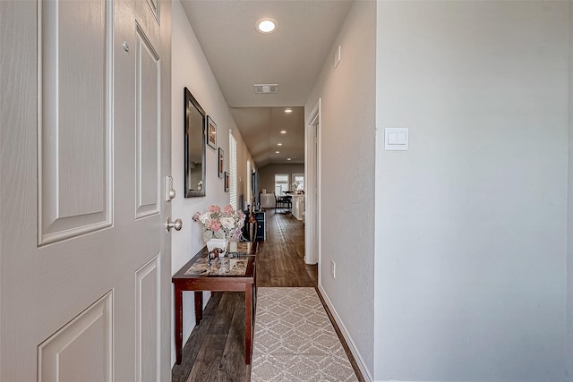 hall with dark wood-type flooring