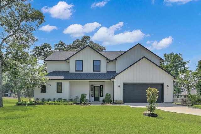 modern inspired farmhouse featuring a garage and a front lawn