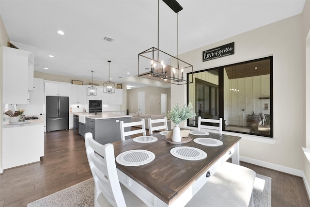 dining area featuring dark hardwood / wood-style flooring