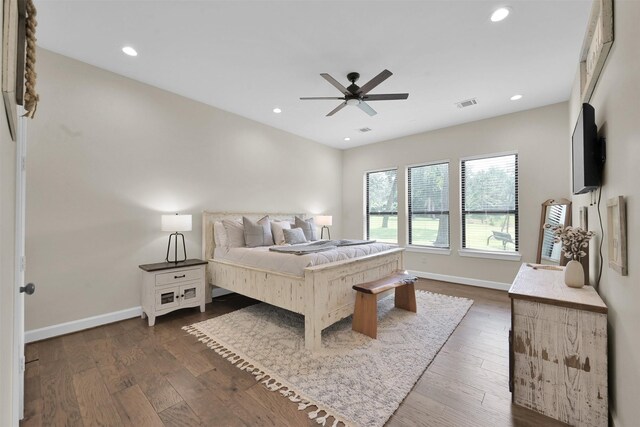 bedroom with ceiling fan and dark hardwood / wood-style flooring