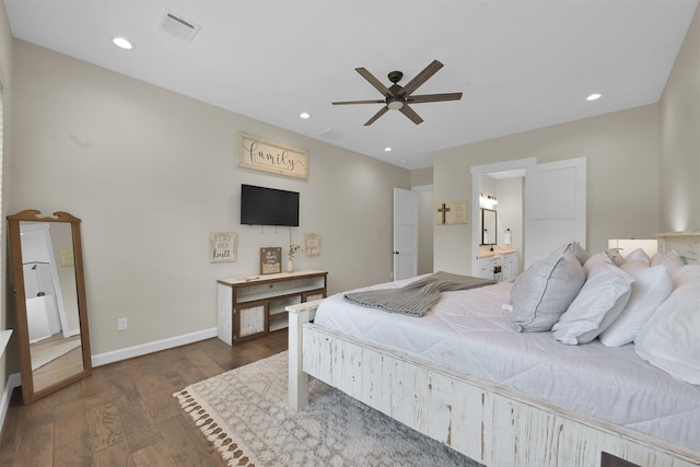 bedroom featuring connected bathroom, ceiling fan, and dark hardwood / wood-style flooring