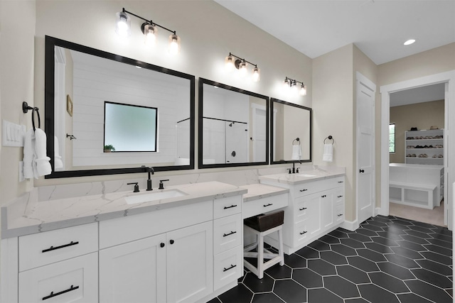 bathroom featuring tile patterned flooring and vanity