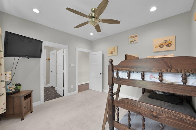 carpeted bedroom with ceiling fan