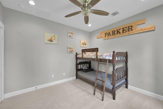 bedroom with ceiling fan and light colored carpet