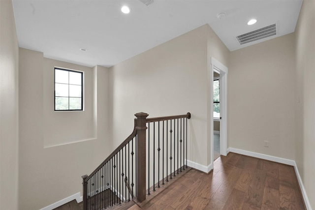 hallway with dark hardwood / wood-style flooring