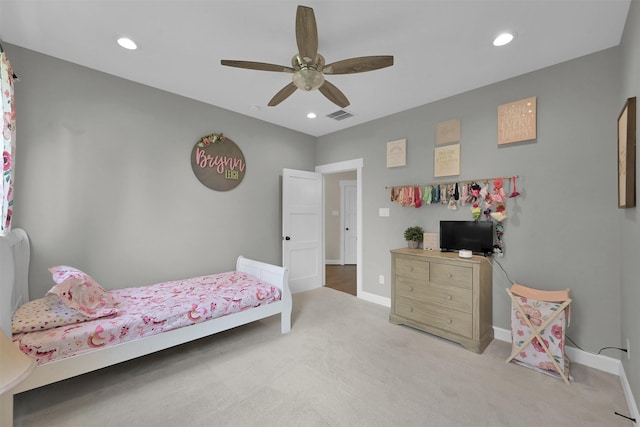 bedroom featuring light colored carpet and ceiling fan