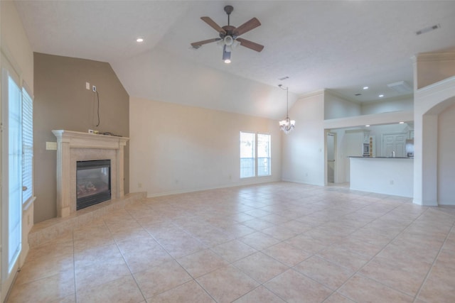 unfurnished living room featuring high vaulted ceiling, a high end fireplace, ceiling fan with notable chandelier, and light tile patterned floors