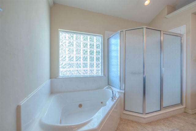 bathroom featuring tile patterned floors and independent shower and bath