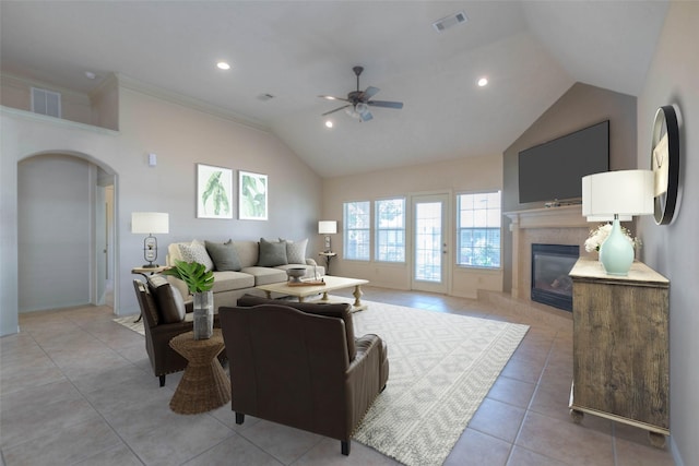 tiled living room with lofted ceiling and ceiling fan