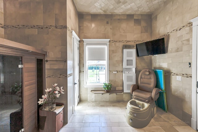 bathroom with tile walls