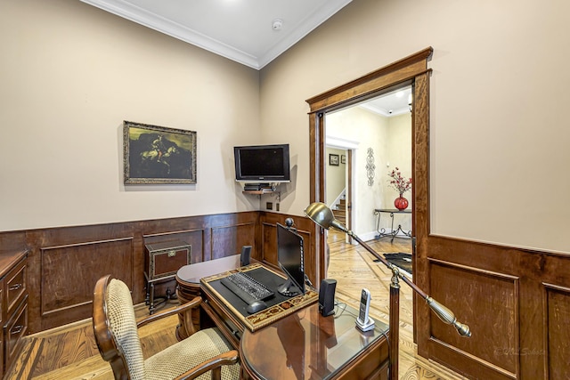 home office with light wood-type flooring and crown molding