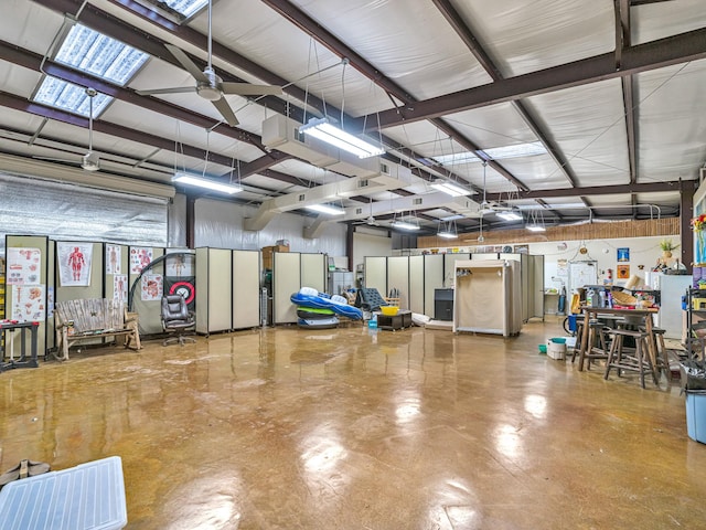 garage featuring stainless steel fridge and ceiling fan