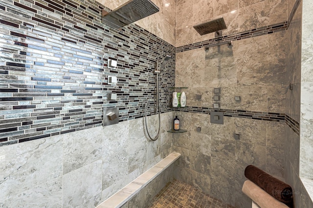 bathroom with a tile shower