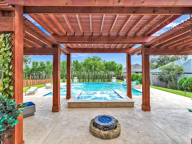 view of swimming pool featuring a pergola, a fire pit, and a patio area