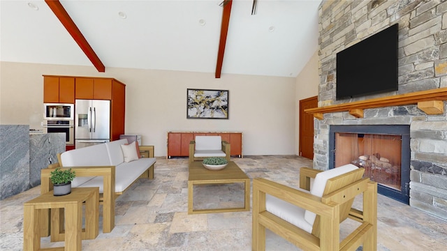 living room featuring beam ceiling, high vaulted ceiling, and a stone fireplace