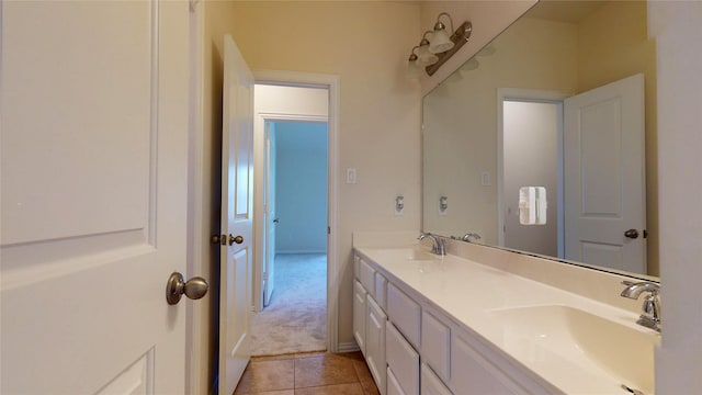 bathroom with tile patterned flooring and vanity