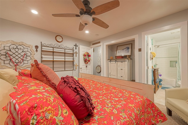 bedroom featuring ceiling fan, carpet floors, and ensuite bathroom