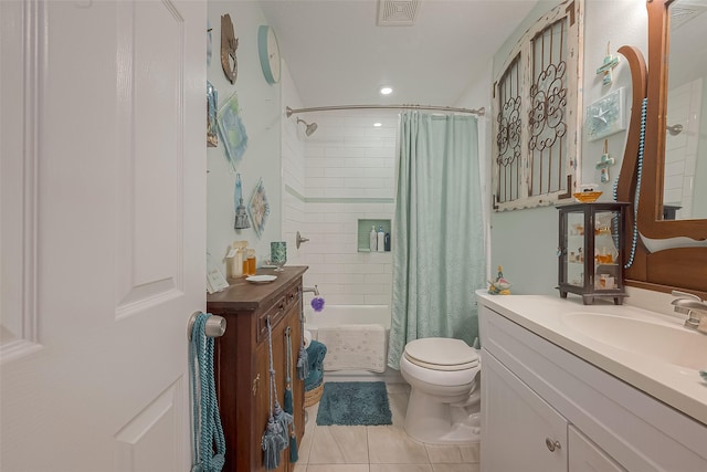 full bathroom featuring tile patterned flooring, vanity, toilet, and shower / bath combo with shower curtain