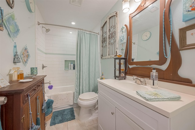 full bathroom with tile patterned flooring, vanity, shower / bath combo, and toilet