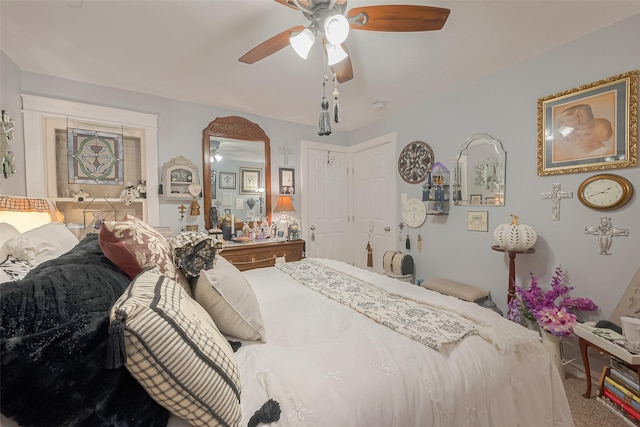 bedroom with ceiling fan and carpet