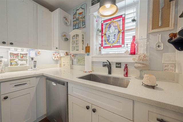 kitchen featuring sink, white cabinets, and stainless steel dishwasher