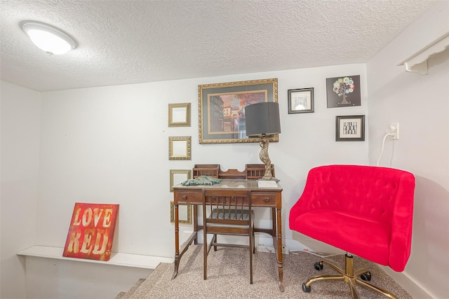 home office featuring a textured ceiling