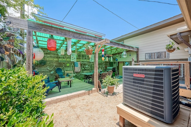 view of patio / terrace with a deck and cooling unit