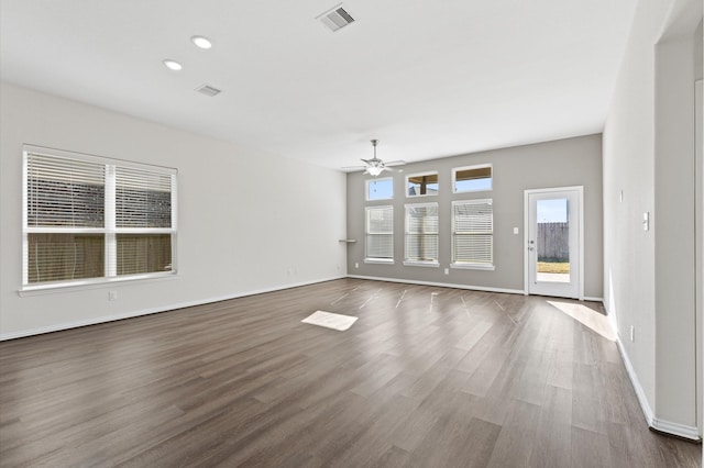 empty room featuring ceiling fan and dark hardwood / wood-style floors