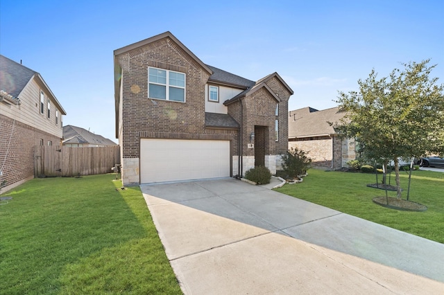 view of front of home featuring a front yard and a garage