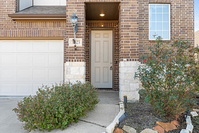 entrance to property featuring a garage