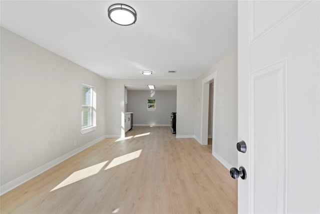 unfurnished living room with light wood-type flooring