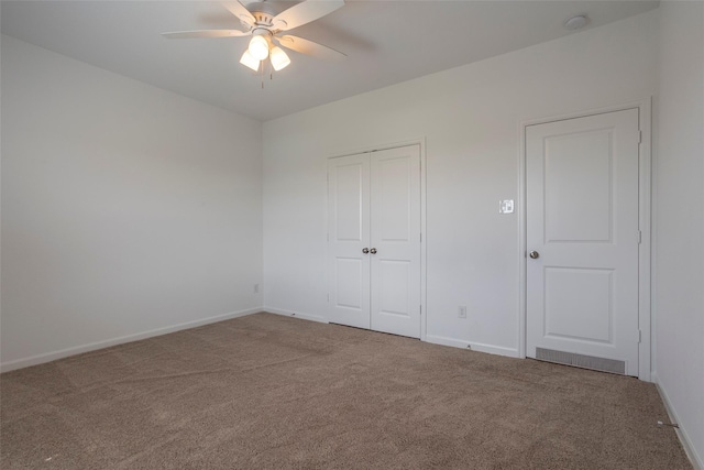 unfurnished bedroom with carpet flooring and ceiling fan