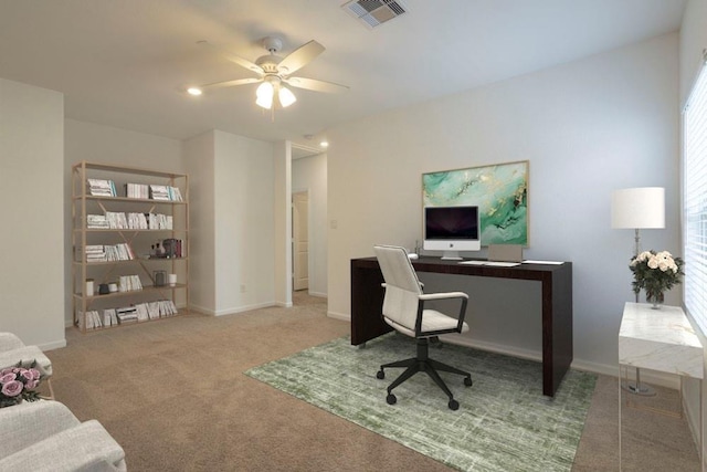 carpeted office with ceiling fan