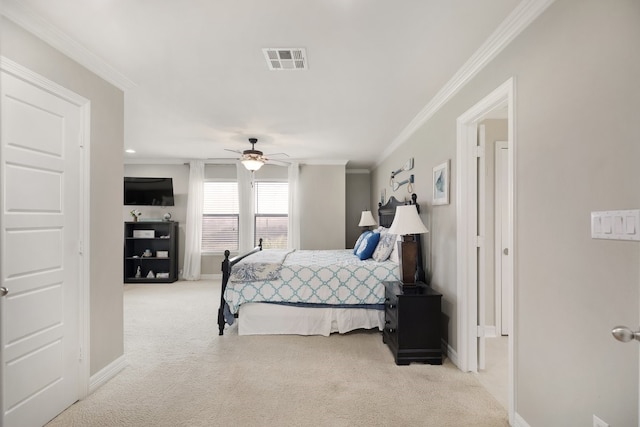 carpeted bedroom with ceiling fan and ornamental molding