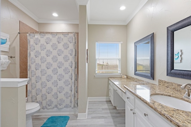 full bathroom featuring wood-type flooring, vanity, ornamental molding, and toilet