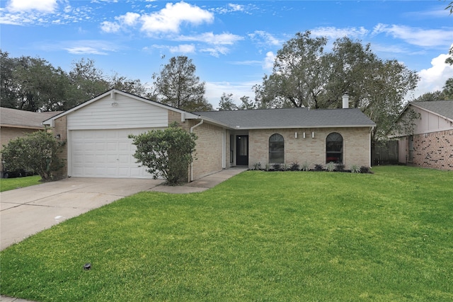 ranch-style home with a garage and a front lawn