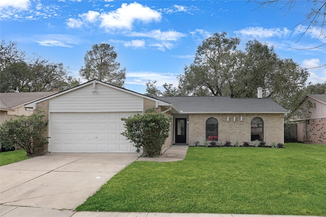 single story home with a garage and a front lawn