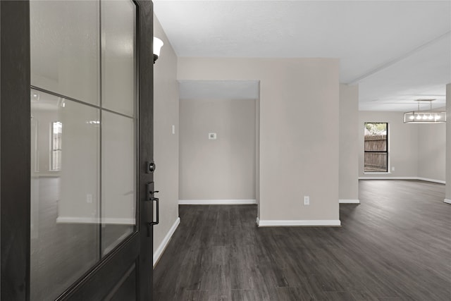 hallway with dark hardwood / wood-style floors