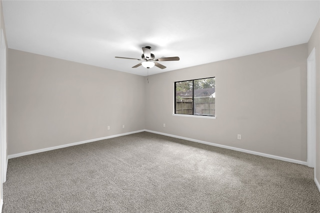 empty room featuring carpet flooring and ceiling fan