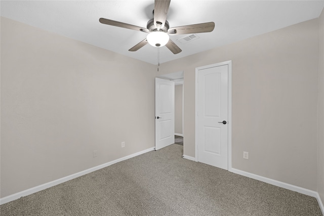 unfurnished bedroom with ceiling fan and carpet