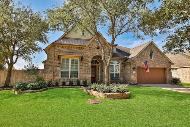 view of front facade with a garage and a front lawn