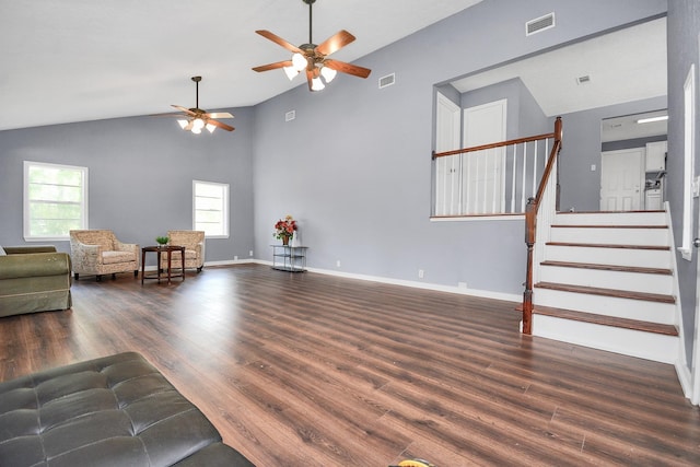 living room featuring dark hardwood / wood-style floors, high vaulted ceiling, and ceiling fan