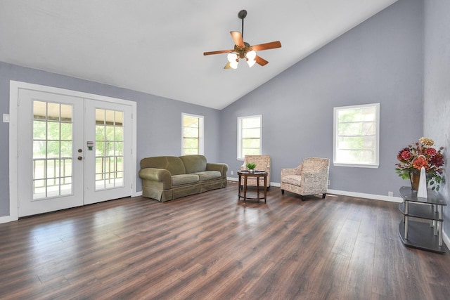 living area with dark hardwood / wood-style flooring, ceiling fan, french doors, and high vaulted ceiling