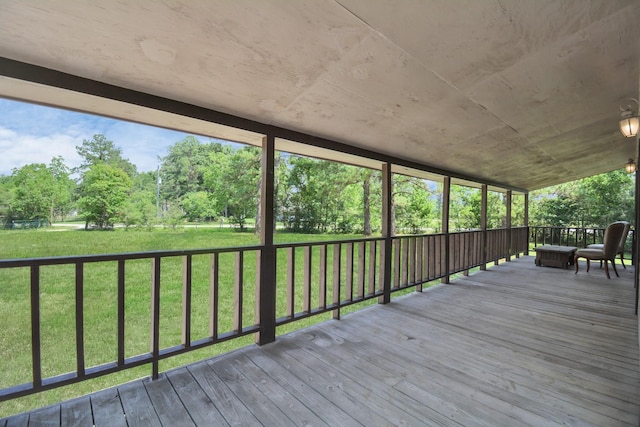 wooden terrace with a yard